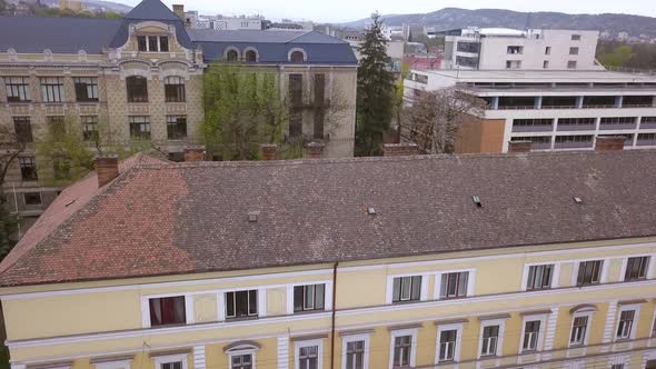 Aerial Drone Shot Over Downtown Cluj Napoca Romania Revealing the Beautiful Architecture. alt