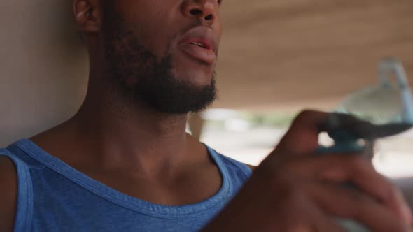 Man training in an urban setting taking a break alt