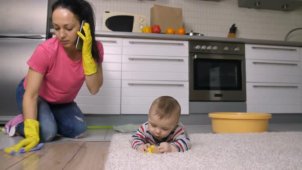 Working Mom Doing Housework While Caring Baby