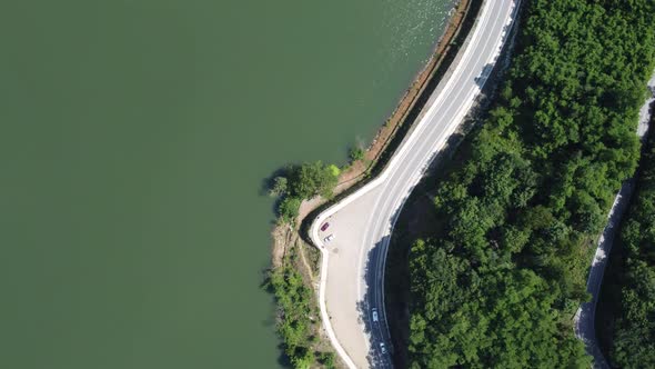 Aerial shot from a high altitude of the lake and road