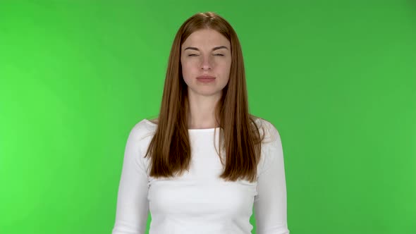 Portrait of Pretty Young Woman Is Waving Hand and Showing Gesture Come Here alt