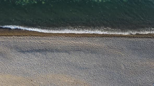 Aerial View From Above on Azure Sea and Pebbles Beach alt