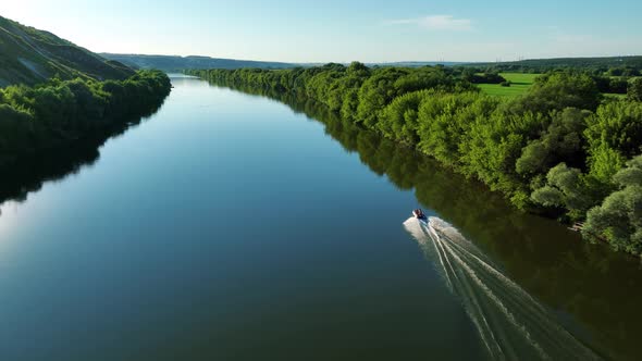 Aerial Video Footage of an Inflatable Boat Floating on the River alt