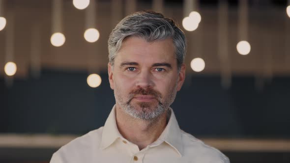 Portrait of Confident Senior Grey Haired Businessman in Stylish Clothes Looking at Camera While alt