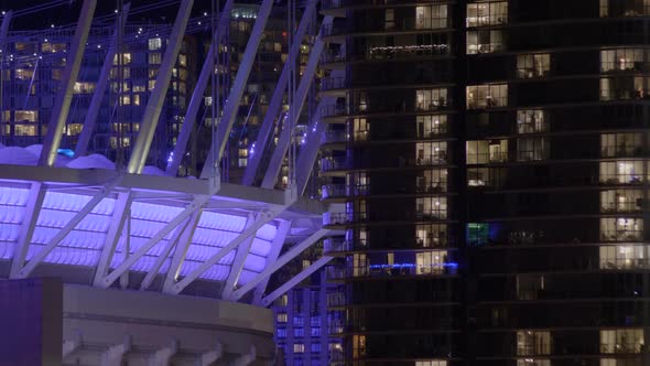Blue Lights On BC Place Stadium With High-rise Buildings In Background At Night In Vancouver, BC, Ca alt