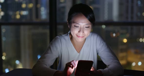 Woman Use of Smart Phone in The Evening