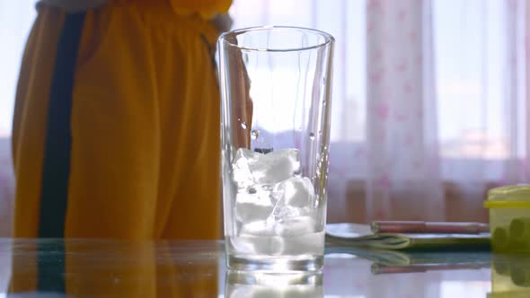 Pouring Orange Drink Into Glass