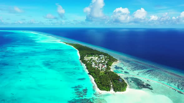 Wide angle above abstract shot of a white sand paradise beach and aqua blue ocean background in colo alt