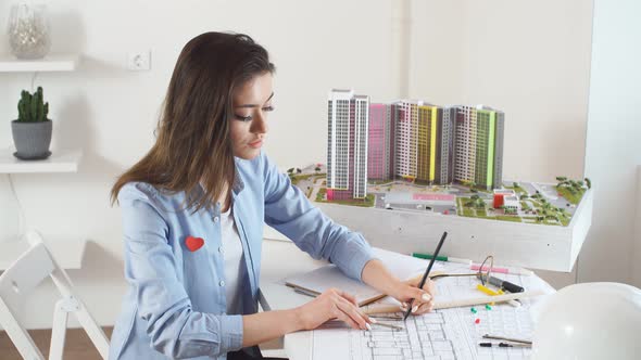 Confident Satisfied Smiling Brunette Woman Creating New Models of Building alt