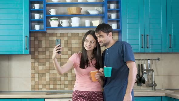 Couple romantic selfie for Internet on your smartphone. Cheerful morning. alt
