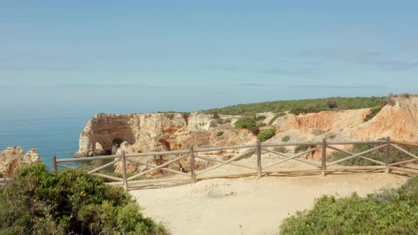 The rocky cliffs of Praia da Marinha alt