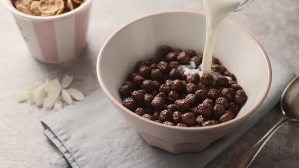 Dry chocolate cereal breakfast in a white bowl