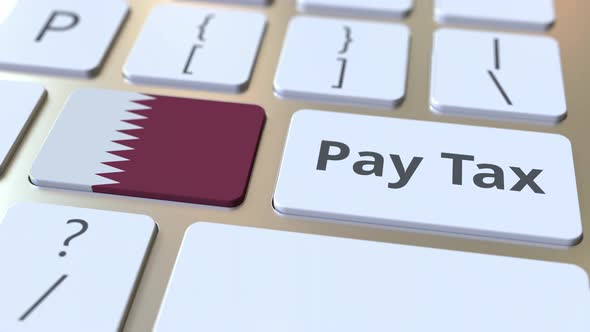 PAY TAX Text and Flag of Qatar on the Computer Keyboard alt