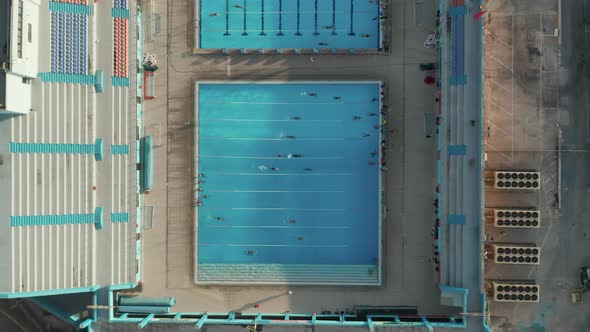 Epic View of Training Swimmers Doing Lanes in Blue Pool in Sunshine alt