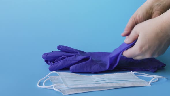 Taking medical gloves and respiratory masks