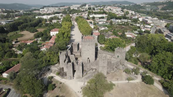 Scenic Guimaraes Castle, Portugal, View Over UNESCO Town, Pull Back Aerial
