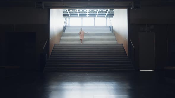 Little Girl Running Down Empty School Staircase Alone alt