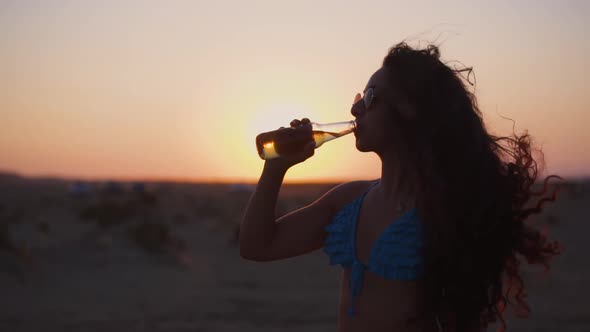 Smiling Woman in Bikini Drinking Beer on Summer Beach Holidays