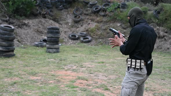Close Up Shot of Man Firing Handgun at Outdoors Range