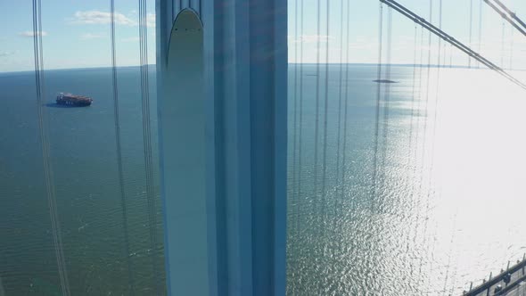 Aerial Drone Shot Descending Down the Side of a Verrazano Bridge Tower in NY