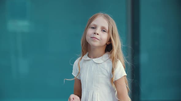Close Up of Active Female Child Girl with Golden Hair, Wearing White Elegant Dress, Dancing Dance on alt