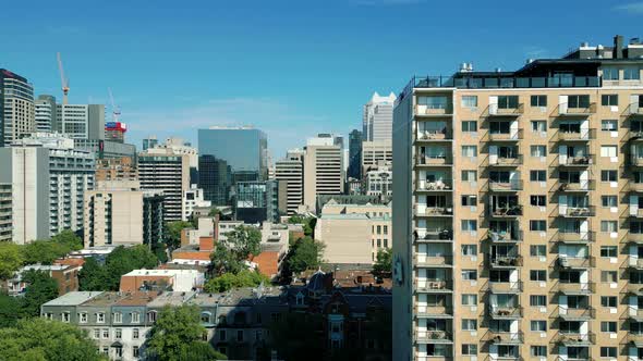 4K Cinematic urban drone footage of an aerial view of buildings and skyscrapers in the middle of dow alt