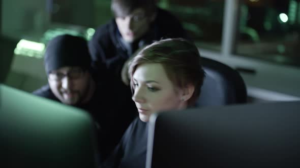 Woman Hacker Working with Team alt