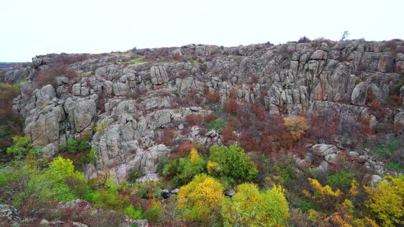 Aktovsky Canyon in Ukraine Surrounded By Autumn Trees and Large Stone Boulders alt