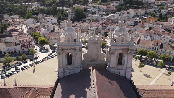 Aerial pan shot of cistercian monastery of Alcobaca overlooking at front foyer alt