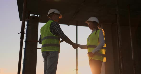 Engineers Shake Hands to Celebrate Success Day alt