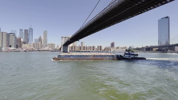 Solid waste management by barge and tugboat in New York, Brooklyn Bridge; aerial alt