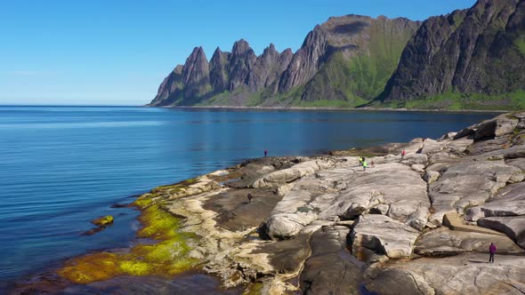 View on popular travel destination and Rock Davil’s Jaw in the sunny summer day, Norway,island Senja