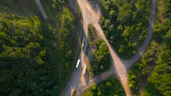 Aerial View of Transport Infrastructure with Old Truck Road and Highway Bridge Overpass alt