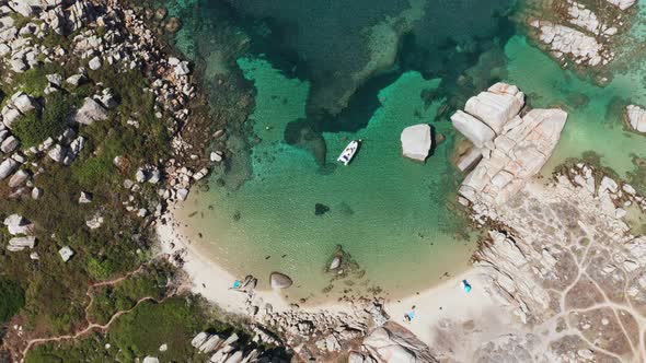 Aerial View of White Sand Beach Blue Sea Marine Vegetationwavestrees and White Rocks alt