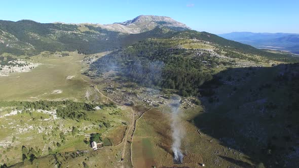 Bushes burning on Dinara mountain alt