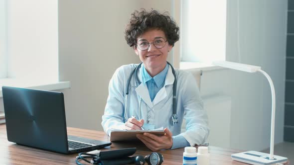 Portrait of doctor doing paperwork