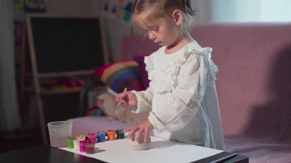 Little Girl Painting Handmade Pot At Home Hobby Leisure Arts Crafts Concept Child Paint Handcraft alt