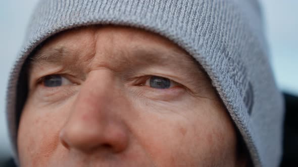 Man In Woolly Hat Looking At Vestrahorn Mountain alt