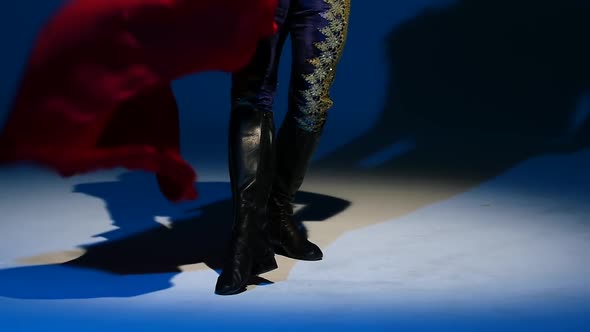 Torero in Blue and Gold Suit or Typical Spanish Bullfighter Isolated Spotlight on a Blue Background alt