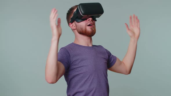 Man Using Virtual Reality Futuristic Technology VR Headset Helmet to Play Simulation 3D Video Game alt