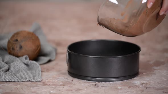 Pouring Cake Mix Into Baking Tin