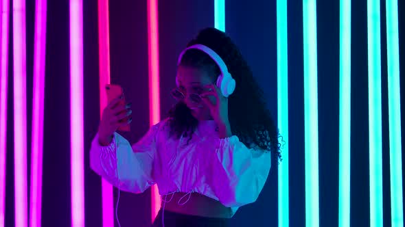 Portrait Young Lovely Female African American Big White Headphones Emotionally Talking Via Video alt