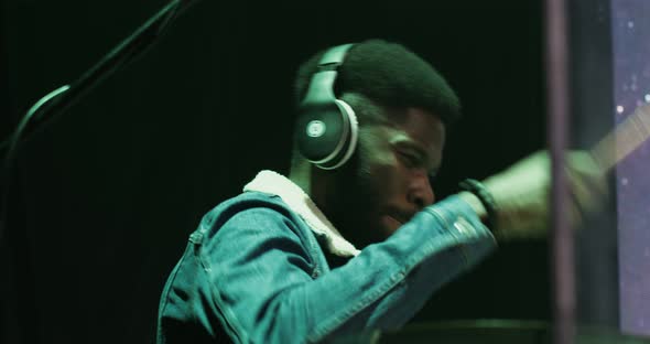 African American Man Energetically Plays the Drum Participates in a Concert alt