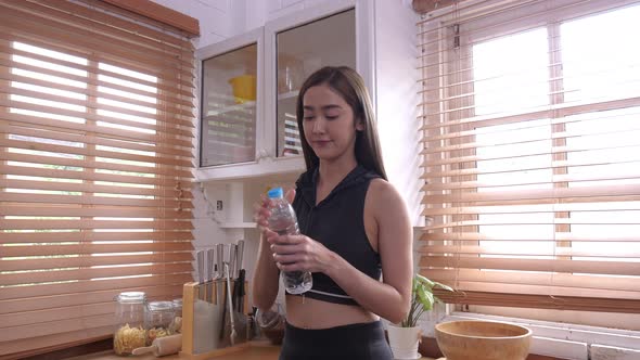 Girl Drinking Water After Exercis