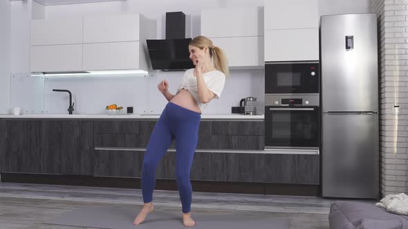 A Woman is Expecting a Baby Dancing at Home to Music a Happy Pregnant Woman