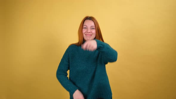 Young Red Hair Woman Posing Isolated on Yellow Color Background Studio
