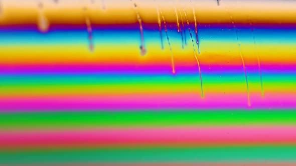 Macro shot of a soap bubble creates a colorful and psychedelic background. Rainbow colors.  alt