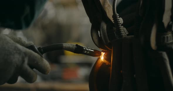 Close Shot Welder Welds Metal Details at Workshop Welding and Metalwork at Locksmith's Workshop 60p alt