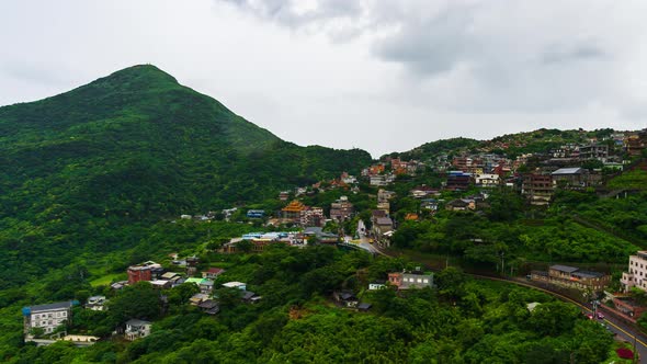 time lapse of Jiufen village with mountain in raining day, Taiwan