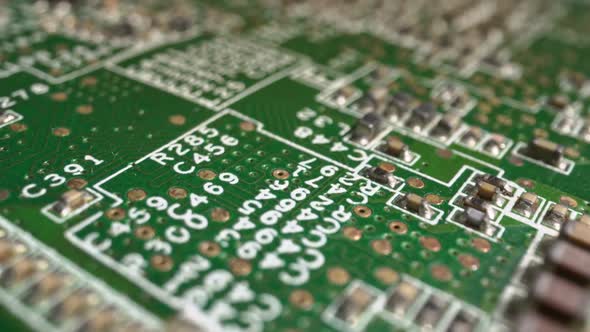 Extreme Closeup of Green Printed Circuit Board Electronics Shot with Dolly alt